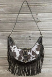 Fame Cow Print Faux Leather Fringe Hobo Bag