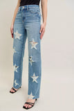 Model wearing Judy Blue plus size 90s high waist jeans with star-shaped destroy design and straight leg fit.