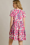 Umgee Full Size Abstract Print Pleat Detail Short Sleeve V-Neck Tiered Dress Plus Size