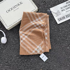 Alt Tag: classic plaid scarf in tan and white check pattern polyester fiber 1-piece imported, folded on textured surface