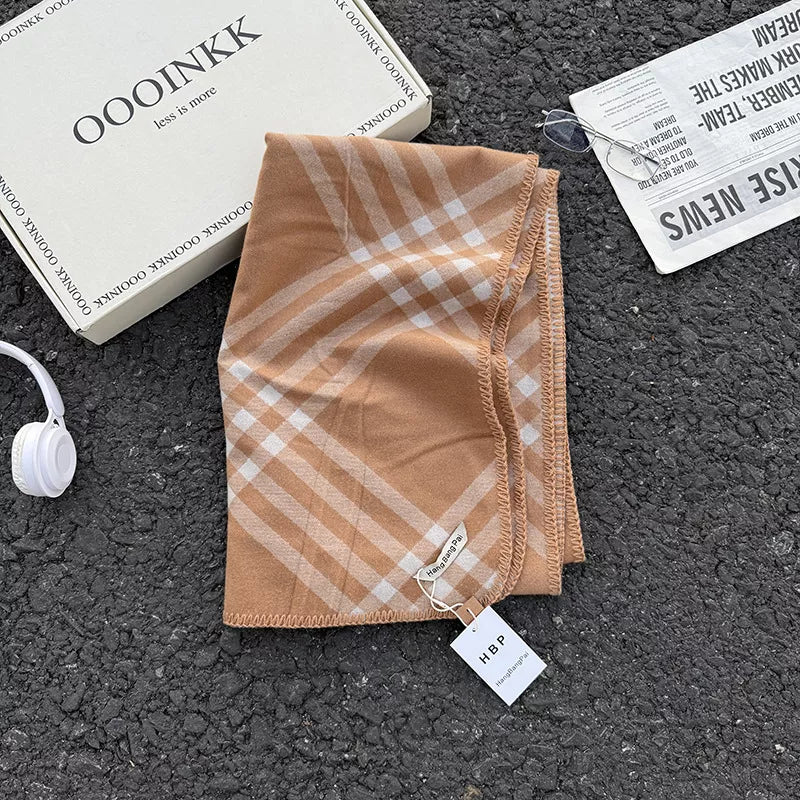 Alt Tag: classic plaid scarf in tan and white check pattern polyester fiber 1-piece imported, folded on textured surface