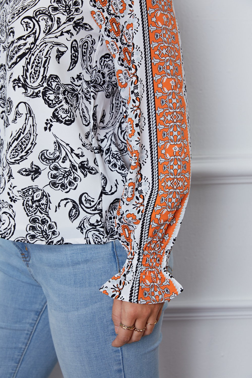 Tassel Tie Neck Printed Smocked Long Sleeve Blouse - felvior