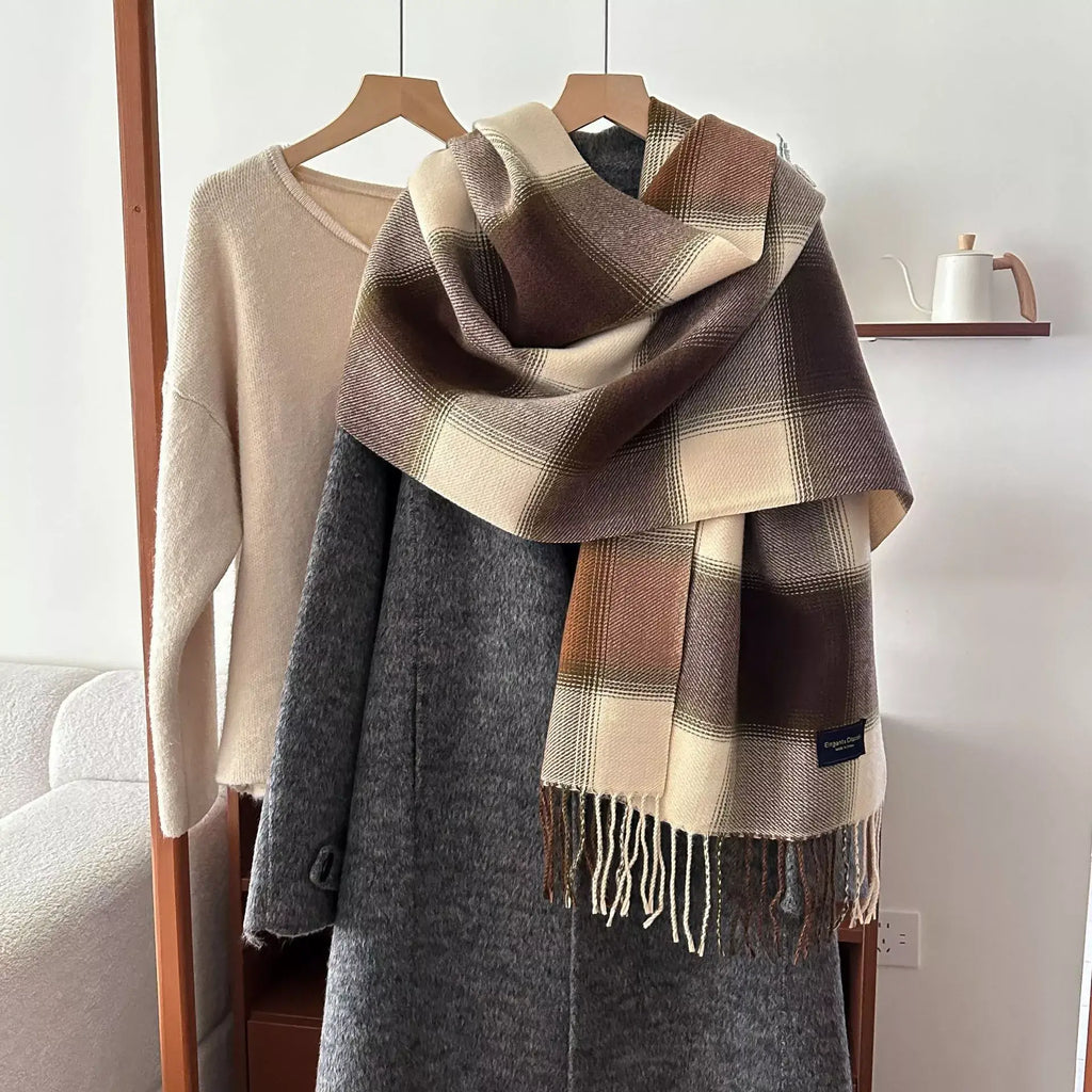 plaid fringe scarf draped on gray coat, brown and beige check pattern with tassel fringe, polyester imported winter accessory