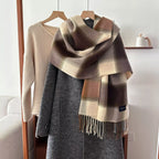plaid fringe scarf draped on gray coat, brown and beige check pattern with tassel fringe, polyester imported winter accessory