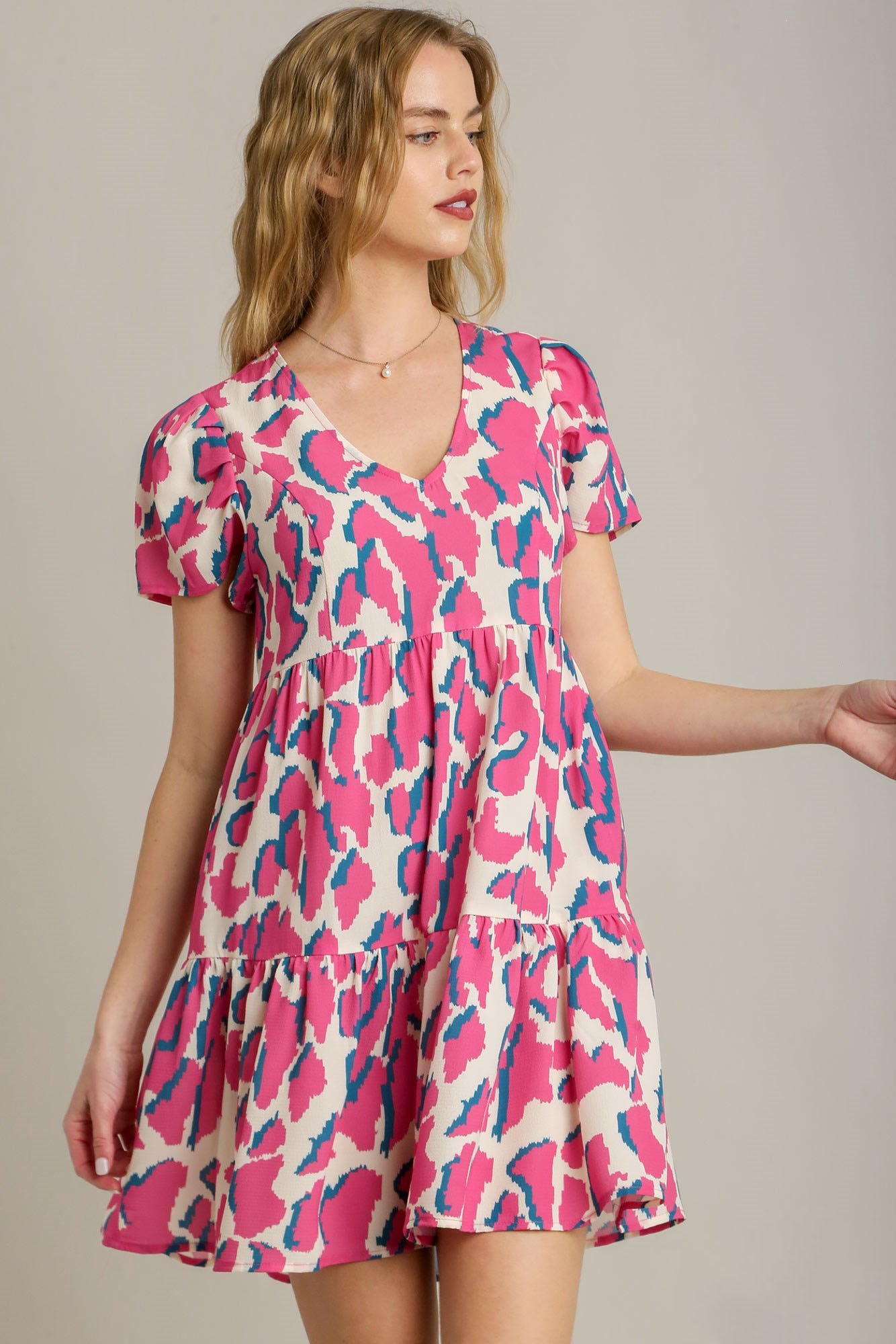 Umgee Full Size Abstract Print Pleat Detail Short Sleeve V-Neck Tiered Dress Plus Size Main image