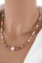 Alt Tag: multicolored bead necklace with freshwater pearls on mannequin, crystal and bead strand with single pearl pendant