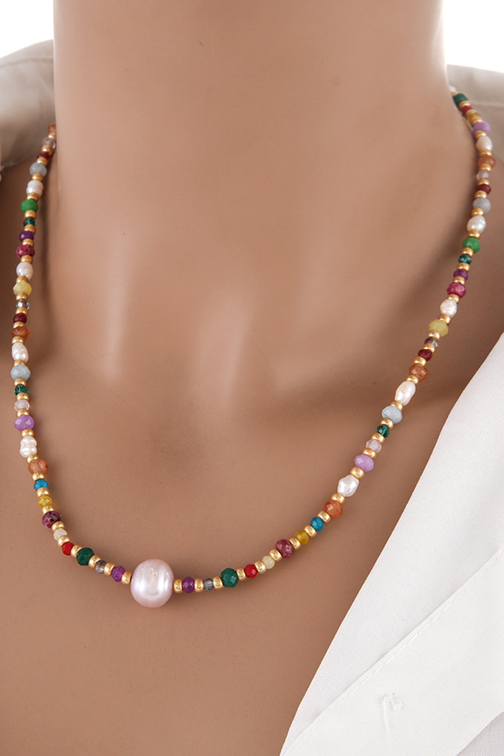 Alt Tag: multicolored bead necklace with freshwater pearls on mannequin, crystal and bead strand with single pearl pendant
